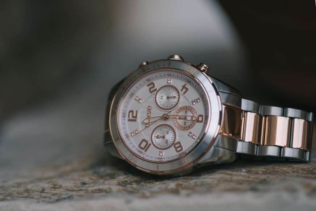 round silver-colored chronograph watch