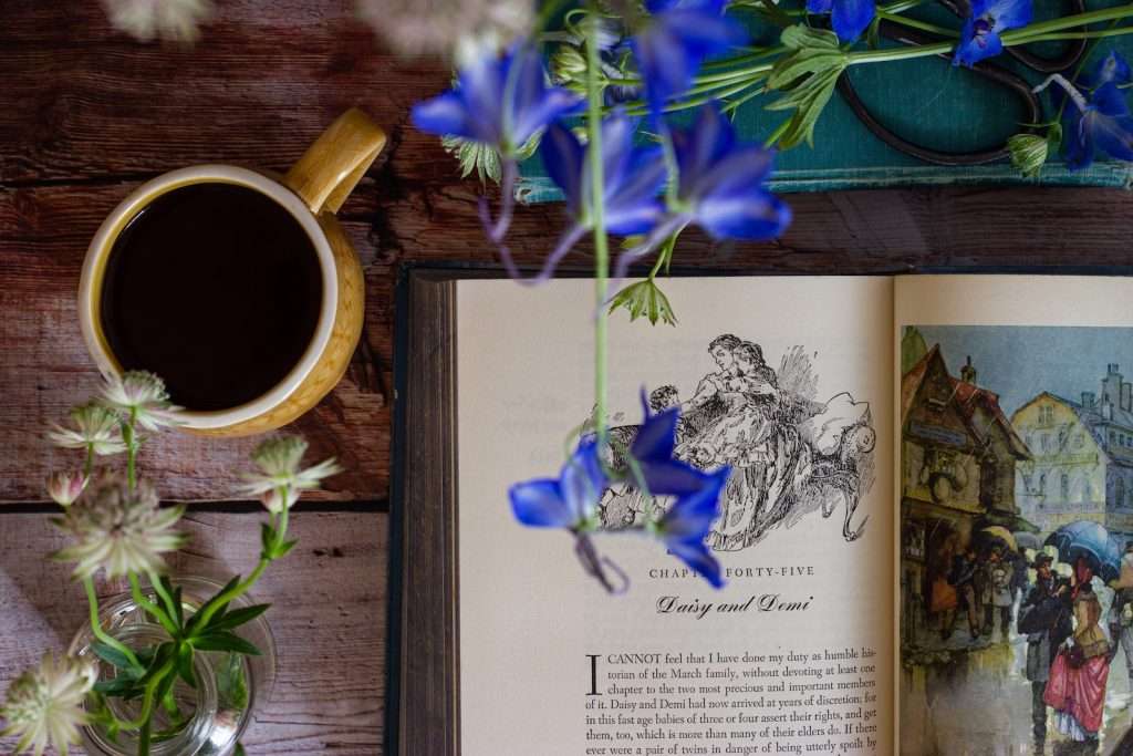 blue and white flower on brown wooden table